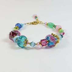 a bracelet with colorful beads and charms