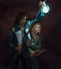 two people standing next to each other in front of a dark background, one holding a light bulb