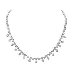 A modern and chic necklace style showcasing round brilliant diamonds weighing 7.81 carats total; Set in a starburst-like setting made in 18 karat white gold. A very brilliant piece of jewelry. 16 inches in length. Platinum Bridal Necklace With 17 Jewels, Exquisite Diamond Cut Necklace In Diamond White, Brilliant Cut Crystal Diamond Necklace, Exquisite Platinum Necklace With Single Cut Diamonds, Dazzling Platinum Necklace With Brilliant Cut, Dazzling Platinum Necklace For Formal Occasions, Exquisite Crystal Diamond Necklace With Single Cut Diamonds, Silver Bridal Necklace With Single Cut Diamonds In Platinum, Silver Platinum Bridal Necklace With Single Cut Diamonds