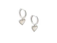 Kendra Scott Ari Heart Huggie Earrings - Earring : Rhodium Ivory Mother-of-Pearl : The Kendra Scott Ari Heart Huggie Earrings are a beautiful hoop with prong-set stone heart pendants. Please refer to color selection for stone detail. 14K gold, 14K rose gold, or rhodium - all plated over brass. Lever back closure. Imported. Measurements: Width: 4 7 in Height: 11 13 in Drop: 2 5 in Weight: 0.1 oz Elegant Sterling Silver Huggie Earrings With Heart Charm, Elegant Nickel-free Huggie Heart Earrings, White Gold Huggie Jewelry For Valentine's Day, Valentine's Day White Gold Huggie Jewelry, Elegant Sterling Silver Heart Huggie Earrings, Elegant Heart-shaped Sterling Silver Huggie Earrings, Silver Huggie Earrings For Valentine's Day Elegant Style, Elegant Double Heart Huggie Earrings With Heart Charm, Silver Elegant Huggie Earrings With Heart Charm