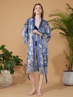 Crafted with meticulous attention to detail, our kimono robe embodies the essence of Eastern luxury, offering you a truly indulgent experience every time you slip it on. Its versatile design effortlessly transitions from leisurely mornings to elegant evenings, ensuring you stay elegant and refined throughout the day. • Silky Comfort: Made of high-quality polyester charmeuse, our robes are soft, lightweight and cooling for summer. They have a smooth and breathable texture that feels just like nat Elegant Floral Print Wrap Robe, Elegant Long Robe For Vacation, Elegant Long Vacation Robe, Elegant Kimono Sleeve Robe For Vacation, Elegant Vacation Robe With Kimono Sleeves, Elegant Robe With Kimono Sleeves For Vacation, Elegant Blue Floral Print Kimono, Elegant Wrap Kimono With Floral Print, Elegant Silk Kimono For Vacation