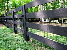 a black fence with metal bars on it