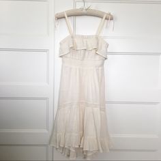 This Flowy, Cotton Dress Will Make You Feel Like Your On Vacation! It’s Light But Is Double-Lined And Great Quality. It’s Meant To Be Strapless, But I Did Sew Straps On. I Can Remove Them At Request. The Skirt Is High-Low:) -Never Worn, Great Condition - Measurements: Bust 29” Waist 25” Length 30 1/2” (Front); 35” (Back) Off White Ruffled Midi Dress For Daywear, White Cotton Midi Dress With Ruffle Hem, Summer Ruffle Dress In Off White, Summer Off-white Ruffled Dress, Off White Ruffled Summer Dress, Chic Cream Sundress For Daytime, Off-white Ruffled Midi Dress For Beach, Off White Ruffled Midi Dress For Beach, Casual Off-white Ruffled Dress