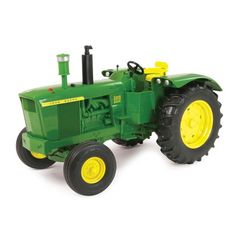 a green toy tractor on a white background