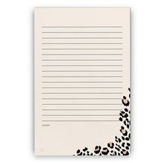 a notepad with an animal print design on the front and bottom, lined in black ink