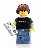 a lego man with headphones holding a remote control