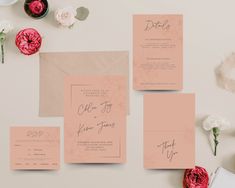 wedding stationery with pink flowers and envelopes