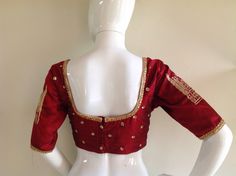 Maroon red pure raw silk blouse with gorgeous Tajmahal embroidery on the sleeves and all over sequin embroidery. Custom fitted. -Measurements sheet will be sent to you once you order( Standard sizing also available) -Custom colors available -Work on front, back and sleeves. Please convo me if you're have any specific requirements. This blouse can be done with or without the bust cup inserts . The blouse is fully lined is cotton. Usual turn around time is 1-2 weeks, but we may be able to accomoda Fitted Chinon Blouse For Diwali, Fitted Chinon Blouse With Resham Embroidery, Fitted Chinon Blouse With Dori Work, Fitted Dola Silk Top With Mirror Work, Bollywood Style Raw Silk Tops With Mirror Work, Fitted Chinon Blouse Piece With Cutdana, Traditional Raw Silk Tops With Mirror Work, Raw Silk Tops With Mirror Work For Festivals, Red Anarkali Style Raw Silk Blouse