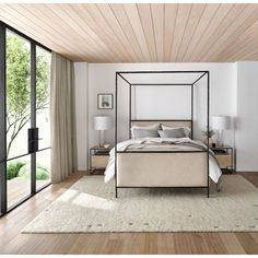 a bedroom with white walls and wood floors