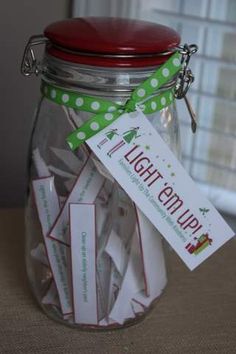 a glass jar filled with lots of tags