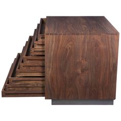 a stack of wooden drawers sitting on top of each other