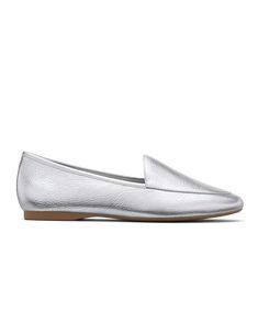 Classic loafers, reinvented. The understated silhouette of our Vesper is elevated with tumbled metallic Nappa leather. High shine and a sleek design allows this striking silver shade to catch the light as you walk. This uniquely relaxed loafer has a flexible toe and heel reinforcement so that you feel supported with every step. We lined our footbeds with a soft breathable leather for added luxury and durability. | The Vesper - Silver Leather Birdies Flats Silver Slip-on Flats With Removable Insole, Chic Silver Slip-on Flats, Classic Silver Flats With Round Toe, Silver Leather Almond Toe Flats, Silver Leather Flats For Spring, Silver Leather Flats For Work, Silver Leather Flats For Formal Occasions, Chic Silver Leather Flats, Formal Silver Leather Flats