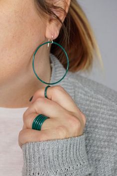 casual holiday style: large circle hoop earrings and stacking rings in emerald green Green Jewelry, Holiday Fashion, Stacking Rings, New Year's, Handcrafted Jewelry, Emerald Green