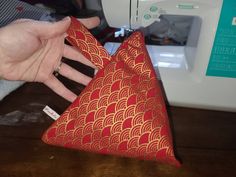 "Soft cloth triangle pouch. Zipper opening is roughly 7\".  Each item is hand made with slight variations from one pouch to the next. Pouch has a loop for easy carrying." Triangle Pouch, Gold Waves, Coin Purses, Purse Pouch, May 31, Red And Gold, Coin Purse, Hand Made, The Next