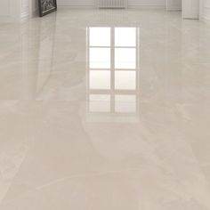 an empty room with white walls and floors