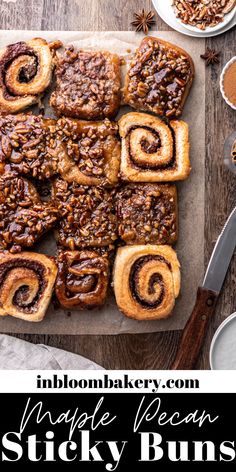 cinnamon roll sticky buns on a cutting board with the words, maple pecan sticky buns