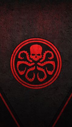 a red and black wallpaper with an octopus emblem on it's center piece