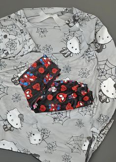 This Hello Kitty Spider Man Loose Pajamas playful characters with soft cotton velvet fabric for a cozy, casual look. Designed with a unique Hello Kitty and Spider-Man pattern, it’s perfect for lounging or sleeping comfortably. The fit and long pants make it a versatile addition to your sleepwear collection. Made from cotton velvet fabric, offering a soft and comfortable texture for all-day wear. Features a fun crossover design of Hello Kitty and Spider-Man, adding a playful touch to your loungew Mens Hello Kitty Pjs, Hello Kitty Pajama Pants Coiple, Cute Hello Kitty Print Loungewear Bottoms, Cotton Hello Kitty Print Loungewear Sets, Casual Hello Kitty Print Sleepwear, Spiderman Web, Comfy Blouse, Warm Pants, Trendy Denim