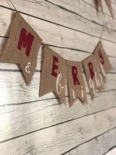 a burlap banner with the words merry and mr and mrs hanging from it