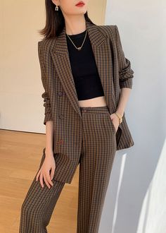 Elevate your wardrobe with the Julia Brown Plaid Blazer Wide Leg Pantsuit Set. This two-piece set exudes sophistication and refinement with its wide-leg pants and plaid blazer. Perfect for any occasion, this set will add a touch of elegance to your look. Embrace your inner fashionista with this statement piece. Notched lapels Long sleeve Double-breasted button closure Wide leg pants Polyester,Spandex Item #241173 Women's blazer & wide-leg pants set SIZE INFO XS=US2=UK6=EU32 S=US4-6=UK8-10=EU34-3 Fall Plaid Suit For Office, Plaid Suit For Office In Fall, Plaid Suit For Fall Office Wear, Fall Single-breasted Office Lady Pantsuit, Fall Double-breasted Sets For Office, Fall Double-breasted Office Sets, Plaid Suits For Fall Workwear, Fall Wide Leg Office Blazer, Wide Leg Fall Office Blazer