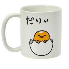 a white coffee mug with an egg in the shape of a face and japanese characters on it