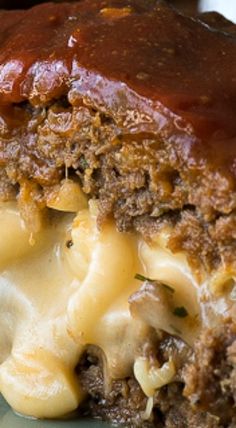 a piece of meatloaf with macaroni and cheese