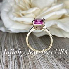 "The ring pictured is lab created sapphire #6419 Video shown in 14k white gold -Approximate total carat weight: 3.90ctw. diamond equivalent -Center Stone Size: approx. 3.90ct diamond equivalent -Center Stone Shape: radiant cut 10x8 mm -Gem Type: lab created pink sapphire -Stone Clarity: VS2 -Stone Color: pink -Moh's Scale: 9 hardness -Metal Type and Purity: 14k yellow gold -Setting: Claw Prong Brasket Head -Stock Ring Size: 6 -Country of Manufacturing: USA (Michigan) For customization please con Gia Certified Classic Pink Sapphire Jewelry, Classic Gia Certified Pink Sapphire Jewelry, Gia Certified Pink Sapphire Ring Gift, Gia Certified Pink Sapphire Ring For Anniversary, Gia Certified Pink Sapphire Anniversary Ring, Cushion Cut Pink Sapphire Rings For Anniversary, Gia Certified Round Cut Pink Sapphire Ring, Pink Sapphire Cushion Cut Rings For Anniversary, Anniversary Pink Sapphire Fine Jewelry Ring