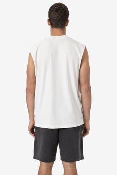 A sleeveless, cutoff version of our bestselling 1801GD Garment Dye T-shirt. This unisex muscle tank features a crew neckline with deep, raw-hemmed sleeves. Made of 100% USA cotton, this textile is beefy, durable, and absorbent, and is virtually shrink free as a result of garment dyeing. The garment is washed with natural enzymes, resulting in a broken-in feel, just like a T-shirt that was washed or worn for a decade or two. Made in Los Angeles, Calif. Our experienced sewers earn up to $25 an hou Lace Knitwear, Kids Garments, Sweater Jumpsuit, Denim Sweater, Sleeveless Tee, Leather Denim, Sleeveless Tshirt, Sleeveless Vest, Active Wear Leggings