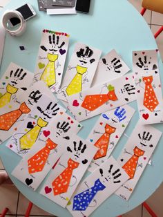 several children's handprints are arranged on a table