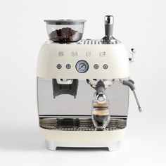 an espresso machine is shown on a white background