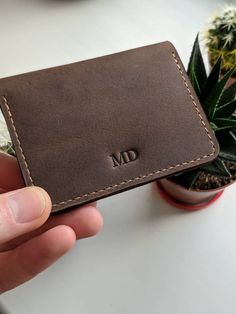 "It is Credit Card Holder made of natural leather. WHAT'S THE PRODUCT ? FOR WHAT IS USED ? Card Wallet is made up of 3 sections for cards .. It is designed for those who uses mostly cashless purchase It is very comfortable for every day usage. You can use it to store cards . Card Holder can be used as a gift for friends and family, which they can really use. (and will appreciate PRODUCT FEATURES - Dimensions 3.94 * 2.75 inch / 10 * 7 cm. in a closed form. - Natural feature - Perhaps a thread of a different color - Add your initials, personalize it! - 3 card pockets, allowing you to carry 8+ cards - Distressed leather, gets better with age . 📍Making You are in the maker's shop 😉 Every wallet is cut and sewn from the very scratch using traditional methods and tools for working with natural Leather Card Holder With Slots As Gift, Leather Card Holder With Card Slots, Leather Card Holder With Slots, Leather Card Holder For Gift, Leather Smooth Grain Card Holder For Gift, Handmade Leather Travel Card Holder, Brown Card Holder With Card Slots For Personal Use, Leather Brown Card Holder For Personal Use, Brown Leather Card Holder For Personal Use