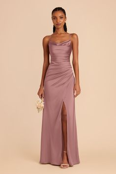 the bridesmaid wears a long, spaghetti - neck gown with side slits