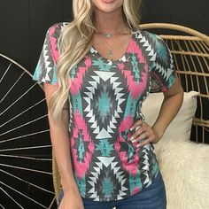 Make A Statement With This Fierce V-Neck Top! Boasting A Sleek Pink, Turquoise, Gray And White Aztec Pattern, It's Sure To Turn Heads! Fit Is True To Size. 55% Cotton 40% Polyester 5% Spandex Casual Pink V-neck Top For Summer, Trendy Pink V-neck T-shirt, Trendy Pink V-neck Top, Casual Pink V-neck Top With Short Sleeves, Affordable Clothing Websites, Aztec Pattern, Clothing Websites, Pink Turquoise, V Neck Tee