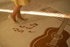 a woman in high heels standing on a rug with musical notes and an acoustic guitar