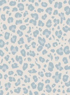 a blue and white animal print wallpaper with spots on the side, in shades of light blue