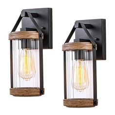 two light fixtures with wood and glass panels