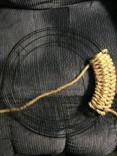 a piece of rope is attached to the back of a pair of jeans