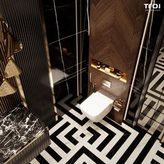 a bathroom with black and white tile, gold fixtures and a toilet in the corner