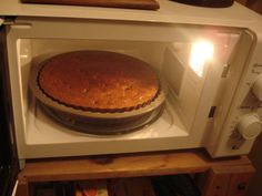 a cake is sitting in the microwave oven