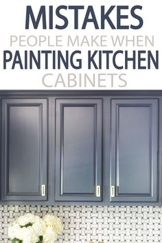 the kitchen cabinets are painted gray and have white flowers in them with text overlay