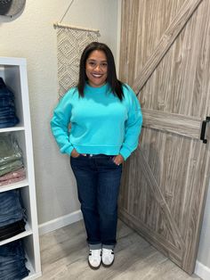 "Get cozy in style with this Aqua Blue Pullover Knit Mock Neck Sweater! Its cropped and oversized fit will keep you both warm and on-trend. Perfect for pairing with high-waisted jeans and boots for a relaxed yet chic look.(No itchy necks here!) Sizing is true to size, I'm in a size large for the perfect cozy feel. Blue Cropped Sweater With Ribbed Cuffs For Fall, Casual Cozy Fit Cropped Sweater With Ribbed Cuffs, Casual Cropped Sweater With Relaxed Fit For Fall, Casual Relaxed Fit Cropped Sweater For Fall, Casual Cropped Sweater With Cozy Fit, Casual Cozy Fit Cropped Sweater For Fall, Oversized Blue Cropped Sweater, Oversized Casual Turtleneck Cropped Sweater, Trendy Blue Sweatshirt For Fall