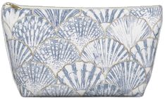 a blue and white bag with an intricate design on the front, featuring scallop shells