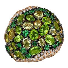 This gorgeous Rodney Rayner domed ring is like a work of art. The 18 karat yellow gold ring has been set with a palette of green stones all in different tones. The combination of Peridot, Tsavorite and Lemon Quartz along with the use of different shapes and sizes of ovals and rounds is what gives this ring it uniqueness. The high dome is finished off with pave diamonds set on either side in a free form organic section. Total Diamond weight 2.98 carats Total Peridot weight 5.19 carats Total Tsavo Lemon Quartz Ring, Tanzanite Studs, Wedding Studs, Engagement Earrings, Precious Rings, Tsavorite Garnet, Dome Ring, Colour Inspiration, Blue Tanzanite