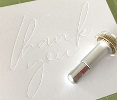 a thank you card with a fountain pen on it