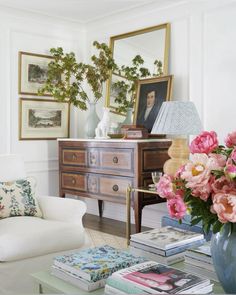 a living room filled with furniture and flowers