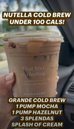 a person holding up a cup of coffee in their hand with the words nutella cold brew under 10 cals