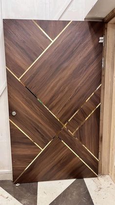 a wooden door with gold lines on it