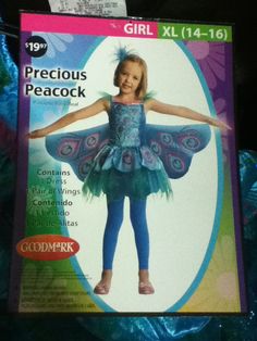 a girl in a peacock costume standing up