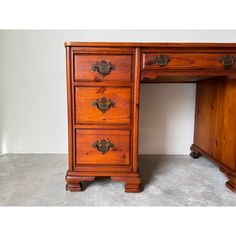 an old wooden desk with two drawers