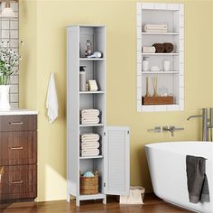 a bathroom with yellow walls and white furniture